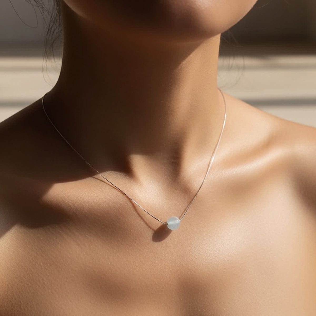 Aquamarine pendant necklace on model.