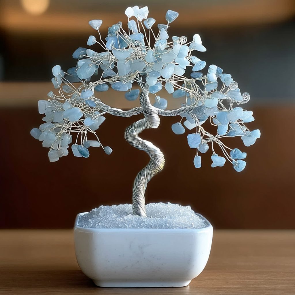 Aquamarine crystal tree bonsai displayed indoors with silver wire branches and blue gemstone leaves