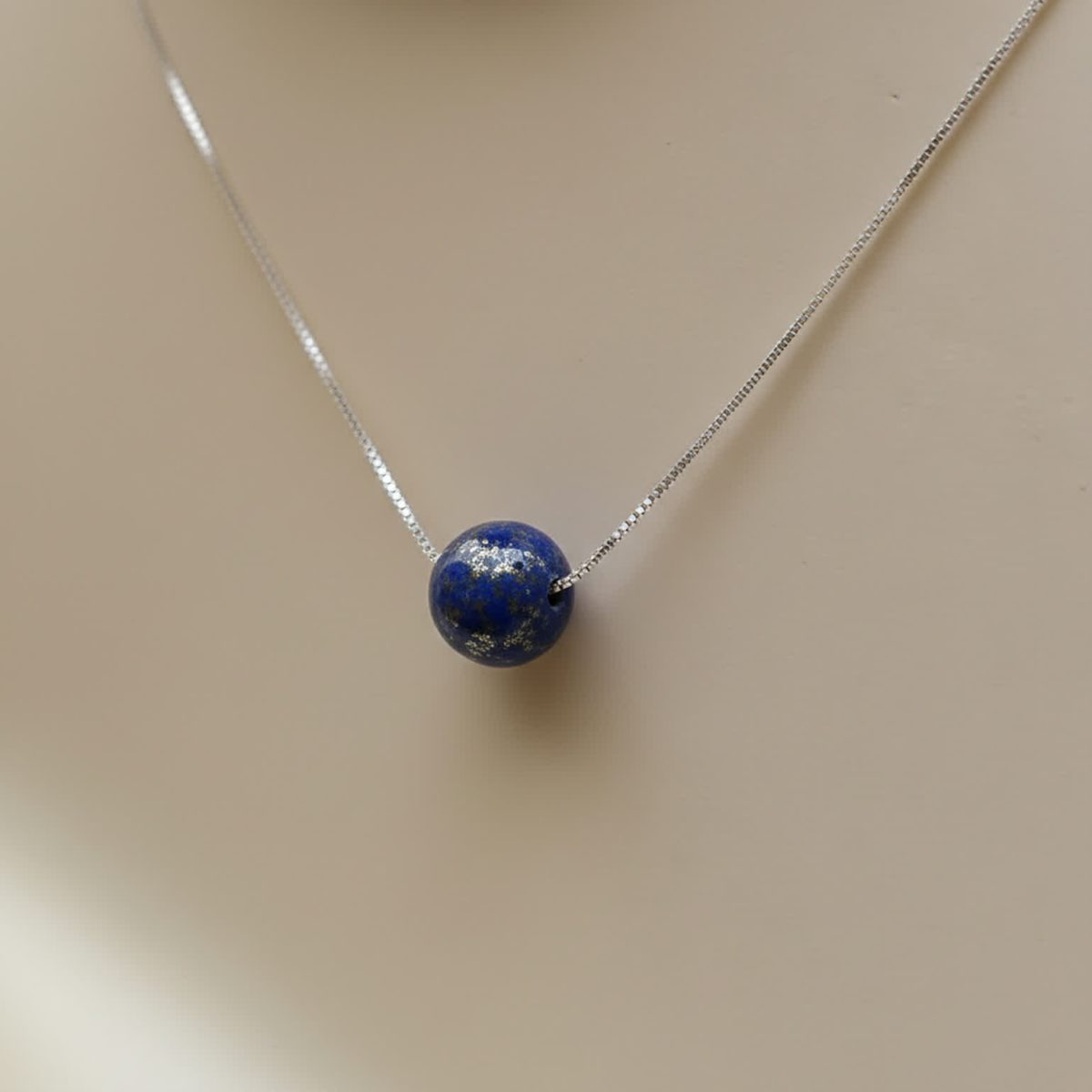 Detailed look at blue lapis lazuli bead with smooth polished finish
