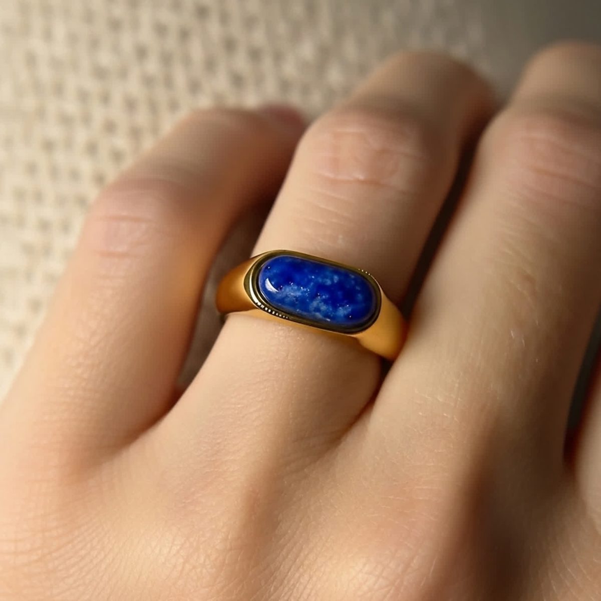 Detailed closeup of lapis lazuli ring showing natural blue tones and subtle gold flecks.