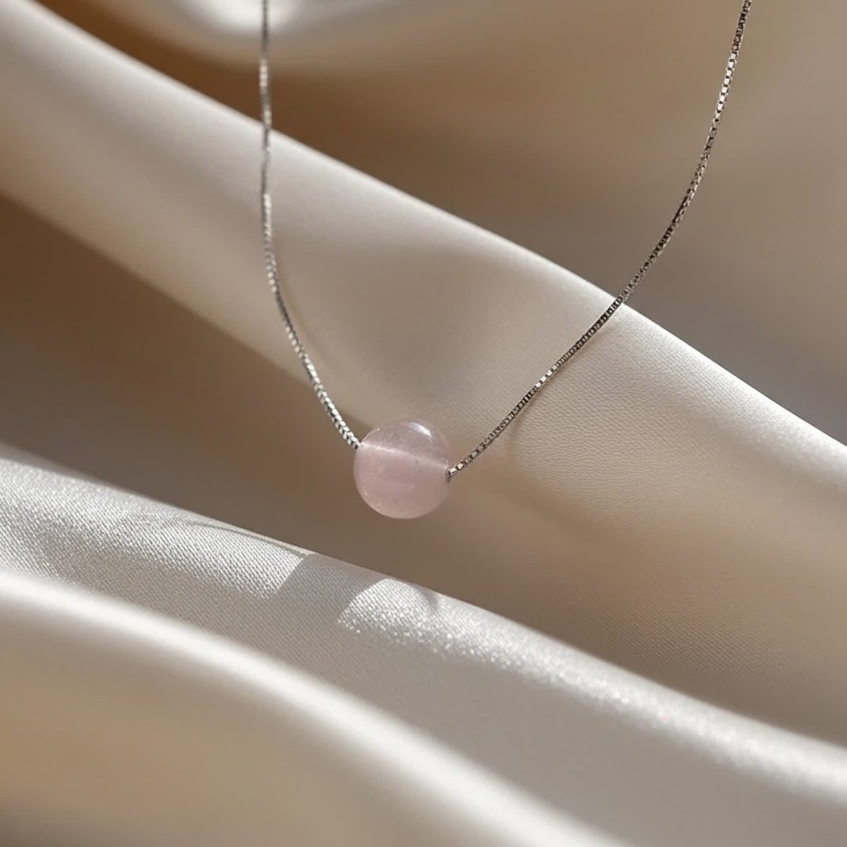Detailed look at polished rose quartz bead in soft light