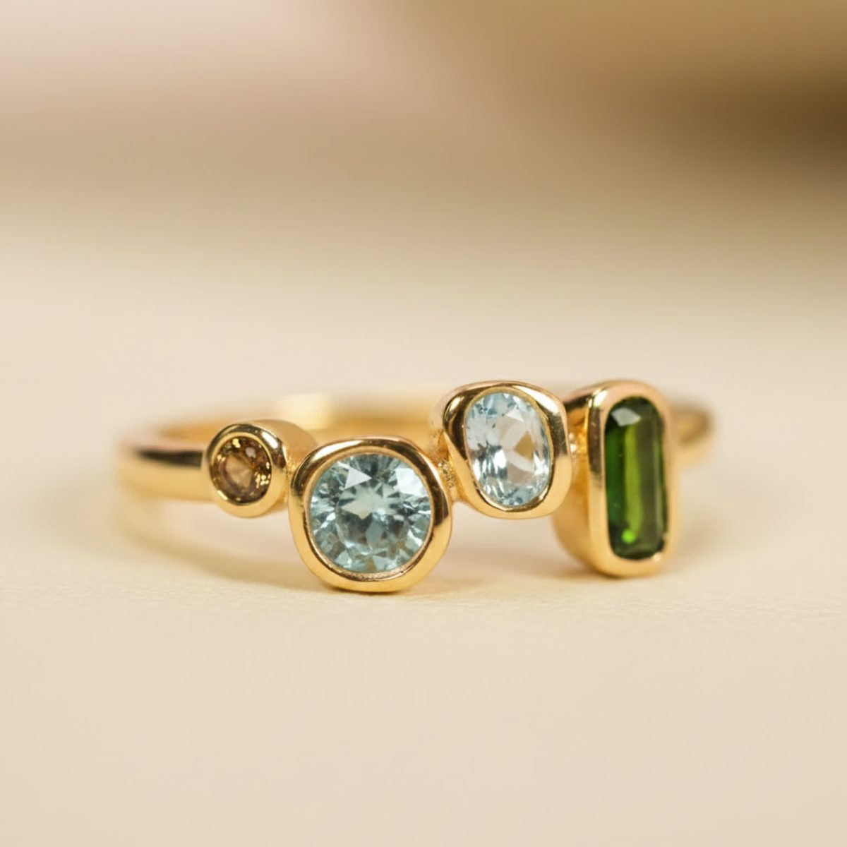 Studio-lit multi-colored gemstone ring showing color contrast and refined gold finish.