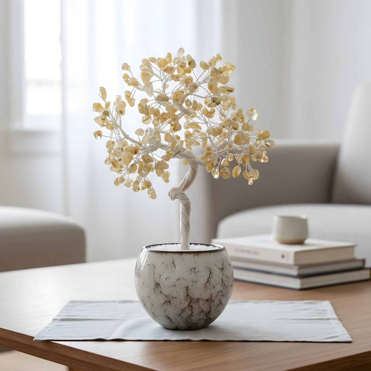 crystal tree of life with citrine gemstones in ceramic bowl on modern tabletop